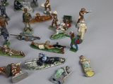 many figurines of different types and sizes on the table