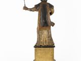 statue of a man holding a wine glass and a wine glass in his hand