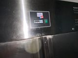 an image of a stainless steel refrigerator in a kitchen