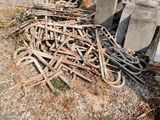 a large pile of wood sitting on the ground next to a construction truck