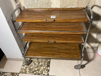 an image of a bathroom with a toilet and a wooden shelf