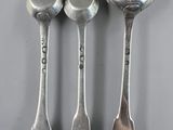 three spoons and two spoons with the word god on them