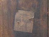 a piece of wood that has a sign on it