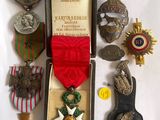 an assortment of medals and medals are displayed in a case