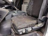 a dirty seat in the back of a truck