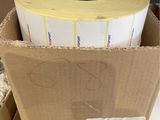 a cardboard box with two rolls of tape in it