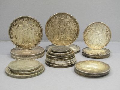 several coins are sitting on top of each other on a table