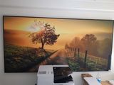 a picture of a picture hanging on the wall of a home office