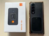 a box with a phone inside of it on a table