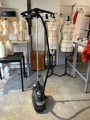 a vacuum that is sitting on the floor in a room