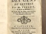 a book open on a table with a black and white image