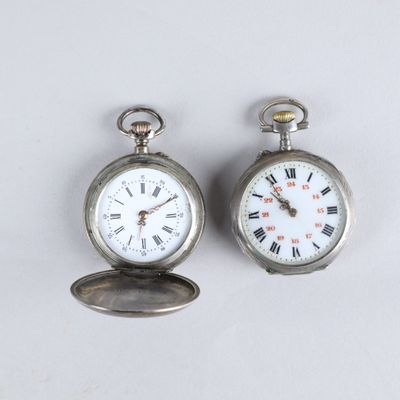 two silver pocket watches with roman numerals and roman numerals on them