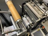 a machine that has a roll of paper on it