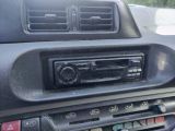 a car radio in the center of the dashboard
