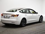 the tesla model s is parked in a white room