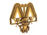 an image of a gold broochle with a bird on top of it