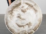 a woman that is holding a large plate in her hands