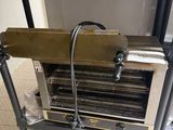 a machine that is sitting on a table in a kitchen