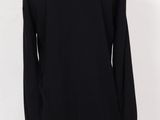 a women ' s black sweater on a mannequin mannequin mannequin mannequin mann