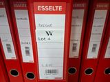 a lot of red binders that are on a shelf