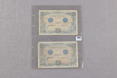 deux billets de banque posés l'un à côté de l'autre sur une table