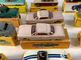 several toy cars are lined up in a row on a table