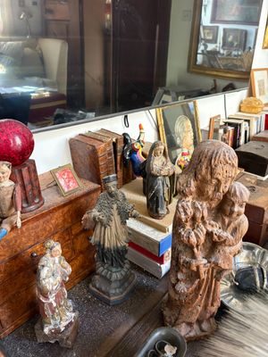 many statues on a table in a room