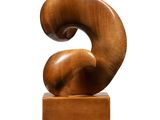 wooden sculpture of the letter s on a wooden base