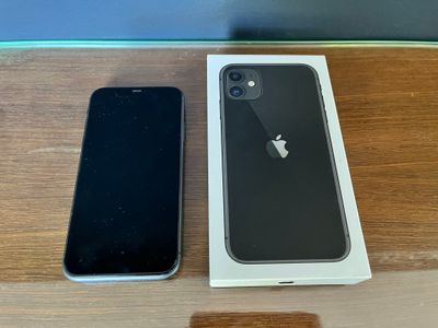 an apple iphone is sitting on a table next to a box