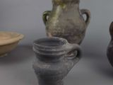 three vases sitting next to each other on a table