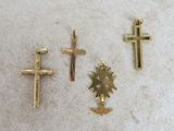 three gold crosses and a cross with a sun in the middle