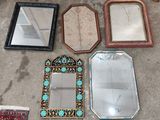 many mirrors and a rug on the floor next to each other