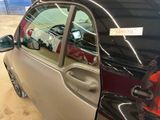 a car that has a broken window in the garage