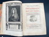 an open book with a picture of a man in a wig on it