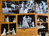 several black and white photographs of people on a wooden table