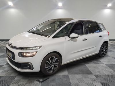 the white citrole is parked on a checkered floor