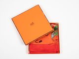 an orange box containing a pair of orange socks and a pair of orange socks
