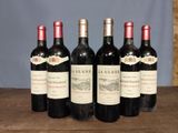 six bottles of red wine are lined up on a wooden table