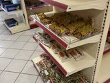 a lot of candy on the shelves in the store