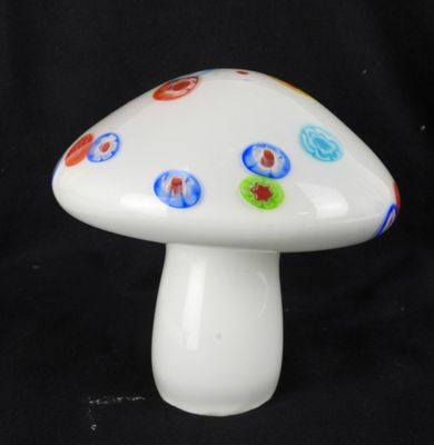 a white mushroom with multicolored dots on it