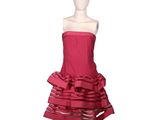 the mannequin is wearing a red dress with ruffles on it