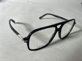 a pair of glasses sitting on a white surface