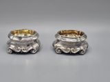 pair of silverplated candlesticks with ornate design