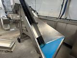 an image of a conveyor belt in a factory with a conveyor belt in the middle of it