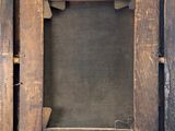 a picture of an old wooden frame on the wall