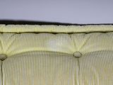 a close up view of a couch with a pillow on it