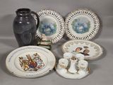 a lot of plates and vases that are on the table