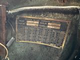 a sign on the back of an old machine