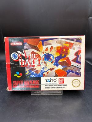 une image représentant une boîte de jeu Nintendo posée sur une surface noire