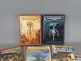 a lot of books that are on the table